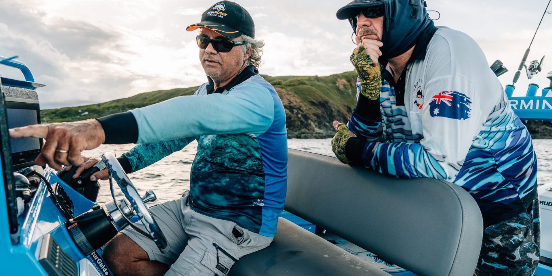 Golden Snapper fishing challenge - men looking for fish on their sounder.